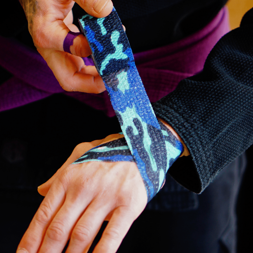 BJJ Flex Joint Support Tape 38mm Blue Camo (6.9m Elastic Wrap Single Roll) - Sticky Grips - wrist application