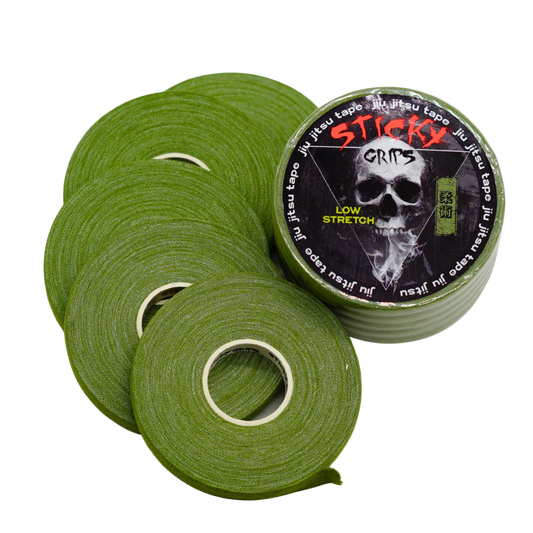 Green tape rolls with a 'Sticky Crips' label featuring a skull design on a white background.