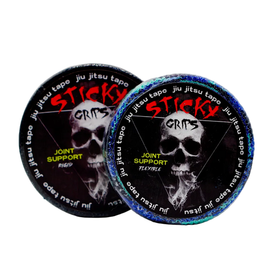 Two containers of Sticky Grips jiu jitsu tape with skull design on a light gray background