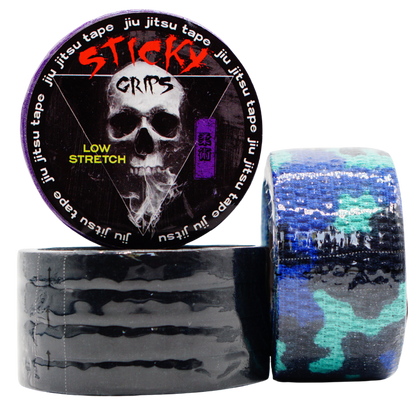 Sticky Grips jiu jitsu tape with a skull design on the packaging, surrounded by rolls of tape.