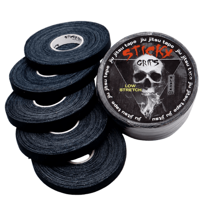 Black jiu-jitsu tape with a 'Sticky Grits' logo
