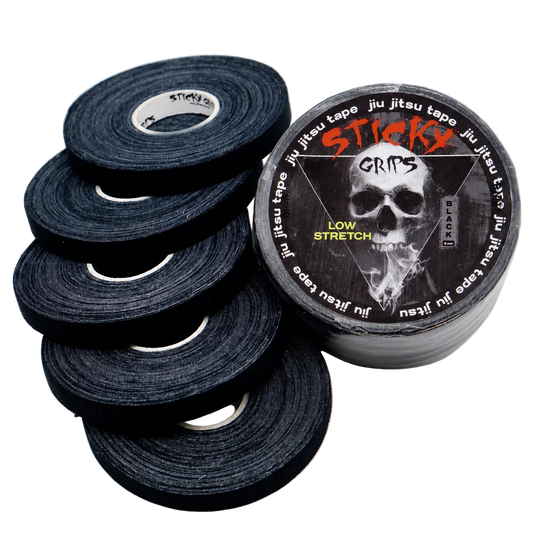 Black jiu-jitsu tape with a 'Sticky Grits' logo