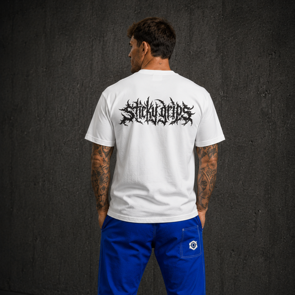 bjj competitor wearing sticky grips shirt