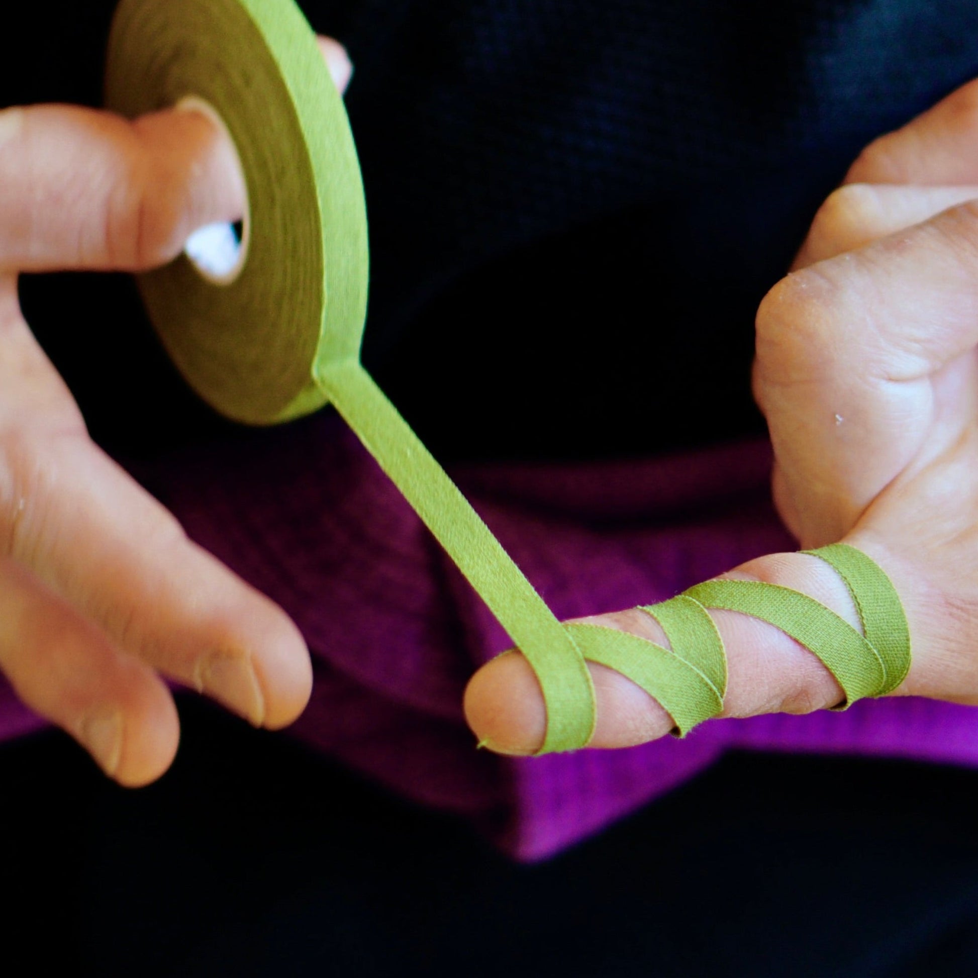 Sticky Grips low stretch BJJ finger tape khaki being applied during training